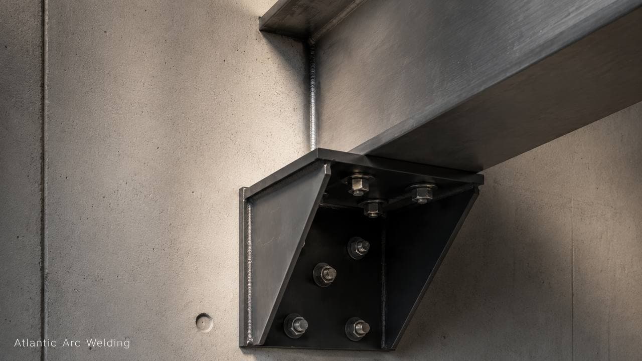 Structural steel beam bracket with a clean weld bead